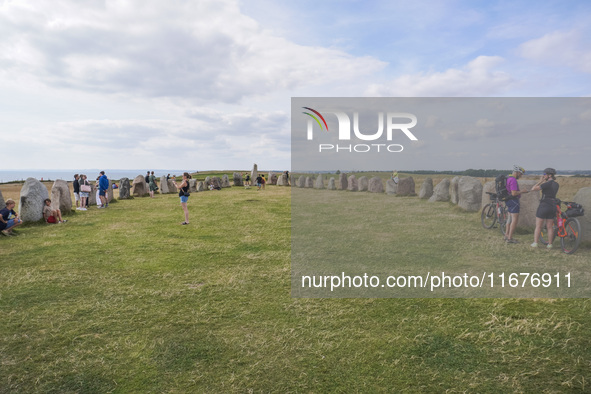 People visit Ales Stenar, also called the Swedish Stonehenge, in Kaseberga, near Ystad, Scane, Sweden, on August 3, 2024. Ales Stenar is a m...