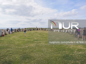 People visit Ales Stenar, also called the Swedish Stonehenge, in Kaseberga, near Ystad, Scane, Sweden, on August 3, 2024. Ales Stenar is a m...