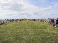 People visit Ales Stenar, also called the Swedish Stonehenge, in Kaseberga, near Ystad, Scane, Sweden, on August 3, 2024. Ales Stenar is a m...