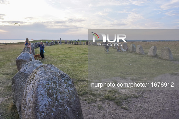 People visit Ales Stenar, also called the Swedish Stonehenge, in Kaseberga, near Ystad, Scane, Sweden, on August 3, 2024. Ales Stenar is a m...