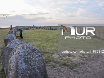 People visit Ales Stenar, also called the Swedish Stonehenge, in Kaseberga, near Ystad, Scane, Sweden, on August 3, 2024. Ales Stenar is a m...