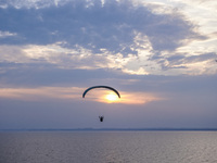 Paragliders fly over the Baltic Sea in Kaseberga, near Ystad, Scane, Sweden, on August 3, 2024. Ales Stenar, also called the Swedish Stonehe...