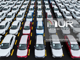 A large number of vehicles collect for shipment at the port of Lianyungang in Jiangsu province, China, on October 18, 2024. (