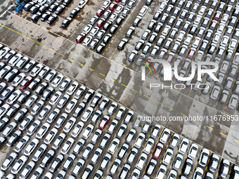 A large number of vehicles are collected for shipment at the port of Lianyungang in Jiangsu province, China, on October 18, 2024. (