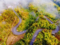 Autumn scenery is seen on a winding road in Xiangchang town, Yuexi County, Anqing city, Anhui province, China, on October 18, 2024. (