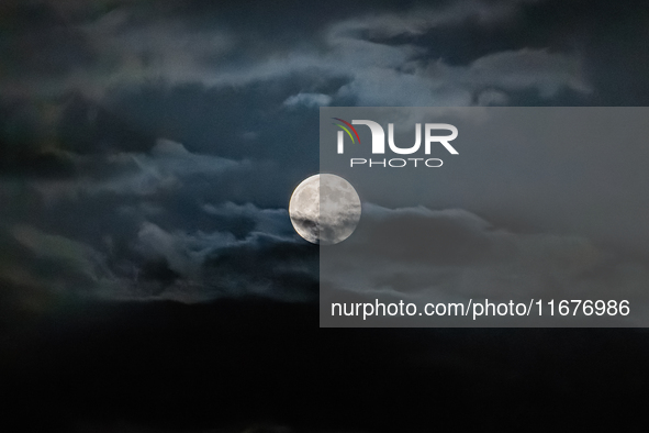 The Full Moon of the Hunter is in the cloudy sky near Andria, Apulia, on October 17, 2024. 