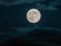 The Full Moon of the Hunter is in the cloudy sky near Andria, Apulia, on October 17, 2024. (