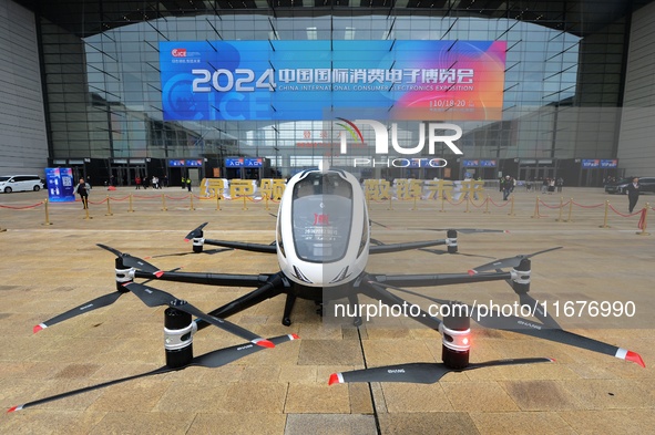 An unmanned electric vertical take-off and landing aircraft is displayed at the 2024 China International Consumer Electronics Expo in Qingda...