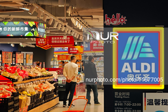 Customers shop at an ALDI supermarket in Shanghai, China, on October 18, 2024. 