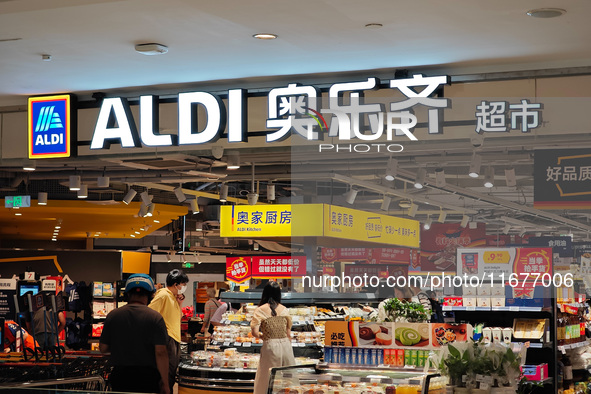 Customers shop at an ALDI supermarket in Shanghai, China, on October 18, 2024. 