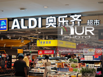 Customers shop at an ALDI supermarket in Shanghai, China, on October 18, 2024. (