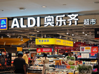 Customers shop at an ALDI supermarket in Shanghai, China, on October 18, 2024. (