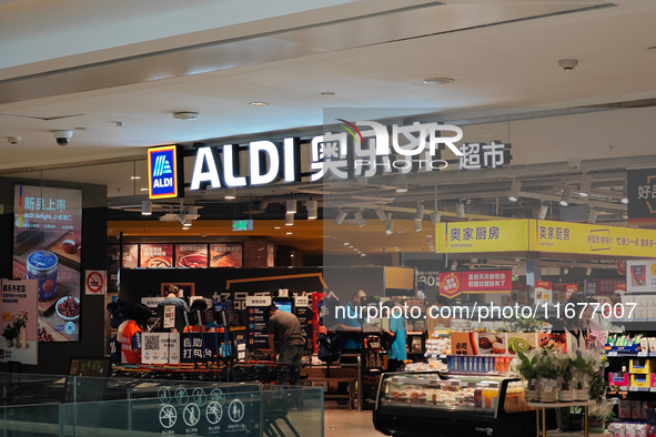 Customers shop at an ALDI supermarket in Shanghai, China, on October 18, 2024. 