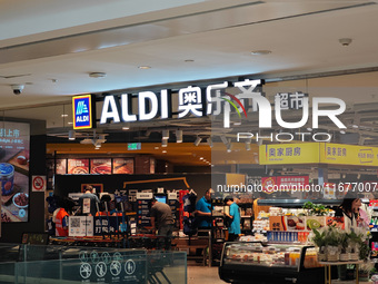 Customers shop at an ALDI supermarket in Shanghai, China, on October 18, 2024. (