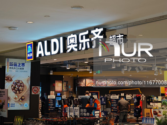 Customers shop at an ALDI supermarket in Shanghai, China, on October 18, 2024. (