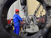 A worker works in a mechanical manufacturing enterprise in Qingzhou, China, on October 18, 2024. On the same day, the National Bureau of Sta...