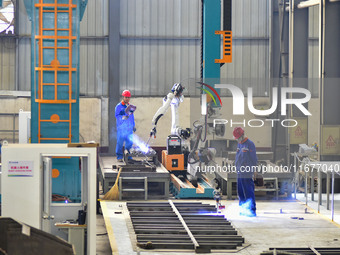 A worker works in a mechanical manufacturing enterprise in Qingzhou, China, on October 18, 2024. On the same day, the National Bureau of Sta...