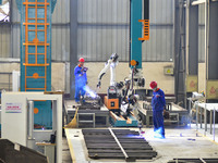 A worker works in a mechanical manufacturing enterprise in Qingzhou, China, on October 18, 2024. On the same day, the National Bureau of Sta...