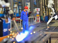 A worker works in a mechanical manufacturing enterprise in Qingzhou, China, on October 18, 2024. On the same day, the National Bureau of Sta...