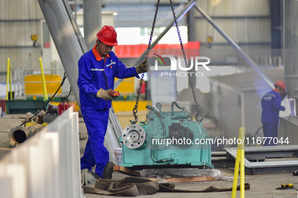 A worker works in a mechanical manufacturing enterprise in Qingzhou, China, on October 18, 2024. On the same day, the National Bureau of Sta...