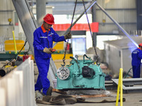 A worker works in a mechanical manufacturing enterprise in Qingzhou, China, on October 18, 2024. On the same day, the National Bureau of Sta...