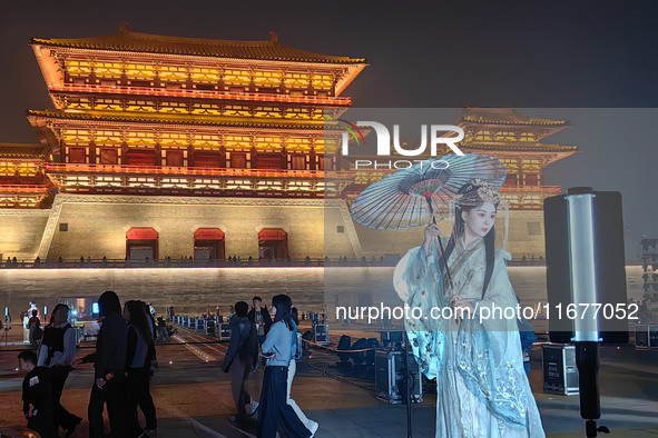 Tourists dressed in Hanfu visit the ancient city of Luoyi in Luoyang, Henan province, China, on October 16, 2024. 