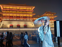 Tourists dressed in Hanfu visit the ancient city of Luoyi in Luoyang, Henan province, China, on October 16, 2024. (