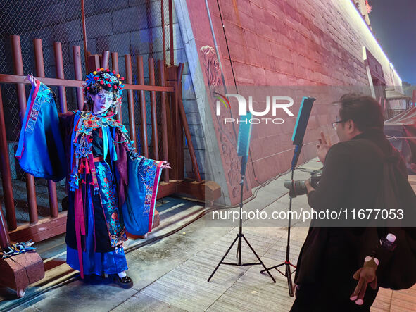 Tourists dressed in Hanfu visit the ancient city of Luoyi in Luoyang, Henan province, China, on October 16, 2024. 