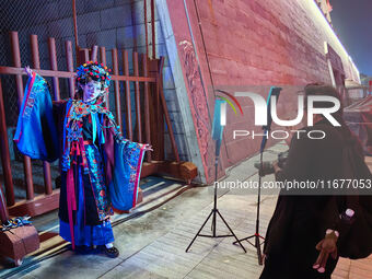 Tourists dressed in Hanfu visit the ancient city of Luoyi in Luoyang, Henan province, China, on October 16, 2024. (