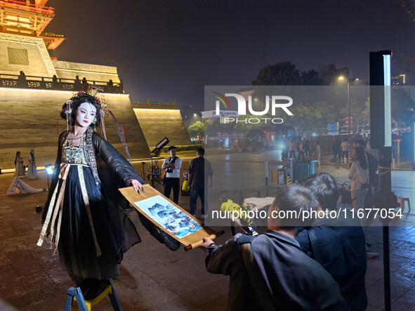 Tourists dressed in Hanfu visit the ancient city of Luoyi in Luoyang, Henan province, China, on October 16, 2024. 