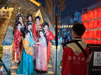 Tourists dressed in Hanfu visit the ancient city of Luoyi in Luoyang, Henan province, China, on October 16, 2024. (