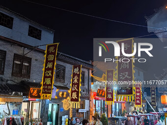 Tourists dressed in Hanfu visit the ancient city of Luoyi in Luoyang, Henan province, China, on October 16, 2024. (