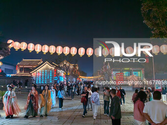 Tourists dressed in Hanfu visit the ancient city of Luoyi in Luoyang, Henan province, China, on October 16, 2024. (