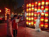 Tourists dressed in Hanfu visit the ancient city of Luoyi in Luoyang, Henan province, China, on October 16, 2024. (