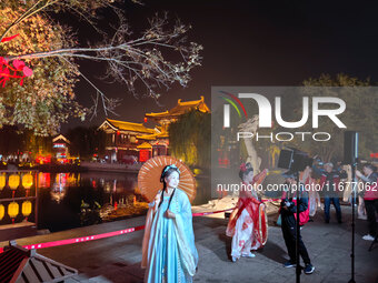 Tourists dressed in Hanfu visit the ancient city of Luoyi in Luoyang, Henan province, China, on October 16, 2024. (