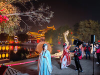 Tourists dressed in Hanfu visit the ancient city of Luoyi in Luoyang, Henan province, China, on October 16, 2024. (