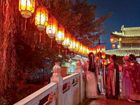 Tourists dressed in Hanfu visit the ancient city of Luoyi in Luoyang, Henan province, China, on October 16, 2024. (