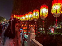 Tourists dressed in Hanfu visit the ancient city of Luoyi in Luoyang, Henan province, China, on October 16, 2024. (