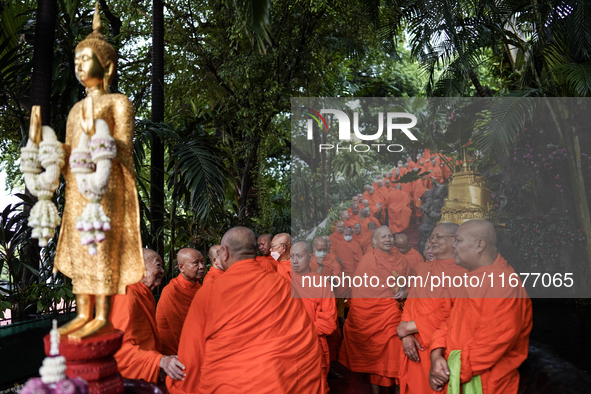 Thai Buddhist monks prepare for a morning alms ritual to mark the end of the Buddhist Lent, known as 'Awk Phansa day', at Golden Mount templ...