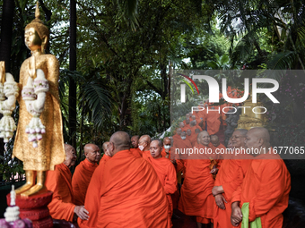 Thai Buddhist monks prepare for a morning alms ritual to mark the end of the Buddhist Lent, known as 'Awk Phansa day', at Golden Mount templ...