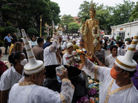 Buddhist devotees attend a morning alms ritual to mark the end of the Buddhist Lent, known as 'Awk Phansa day', at Golden Mount temple in Ba...