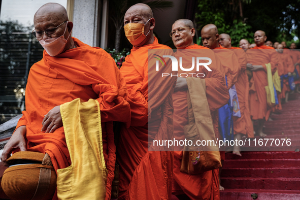 Thai Buddhist monks prepare for a morning alms ritual to mark the end of the Buddhist Lent, known as 'Awk Phansa day', at Golden Mount templ...