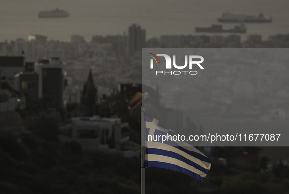 A Greek flag is seen on a mountainside overlooking the city. Limassol. Cyprus, Friday, October 18, 2024. The Cyprus issue is a European prob...