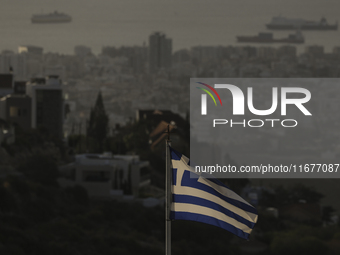 A Greek flag is seen on a mountainside overlooking the city. Limassol. Cyprus, Friday, October 18, 2024. The Cyprus issue is a European prob...