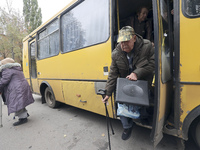 People from the Kupiansk community arrive at an evacuation point as mandatory evacuation from four communities in the Kharkiv region begins...