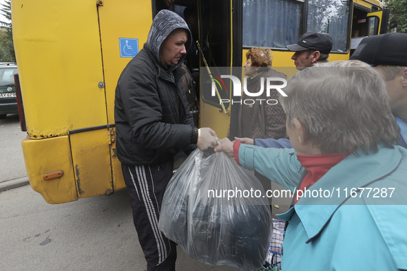 People from the Kupiansk community arrive at an evacuation point as mandatory evacuation from four communities in the Kharkiv region begins...