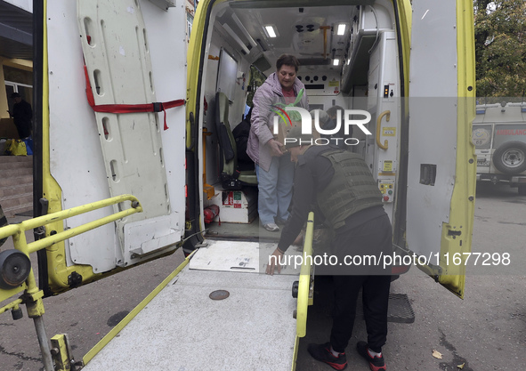 People from the Kupiansk community arrive at an evacuation point as mandatory evacuation from four communities in the Kharkiv region begins...