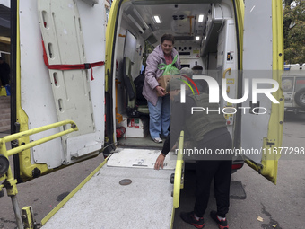 People from the Kupiansk community arrive at an evacuation point as mandatory evacuation from four communities in the Kharkiv region begins...