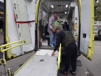 People from the Kupiansk community arrive at an evacuation point as mandatory evacuation from four communities in the Kharkiv region begins...