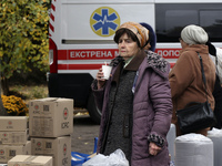 An elderly woman has a hot drink at an evacuation point during the arrival of people from the Kupiansk community in Kharkiv, Ukraine, on Oct...